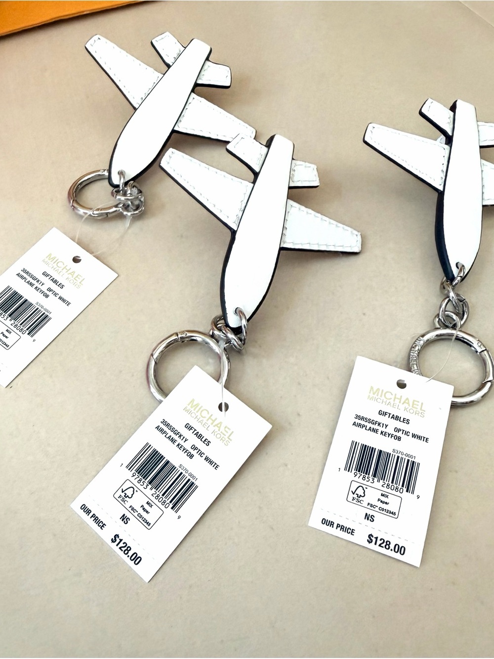 MICHAEL Michael Kors White Leather Airplane Keychain
